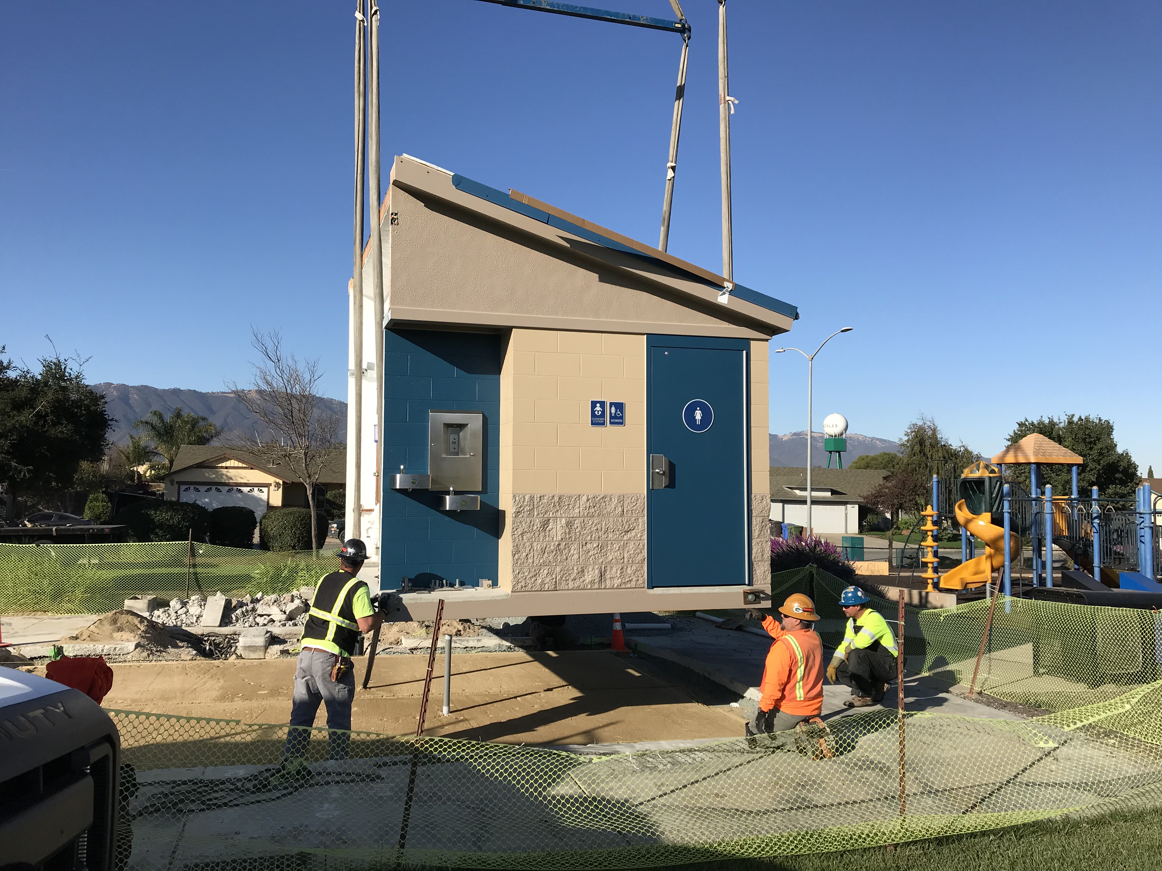 workers installing the two piece prefab unit
