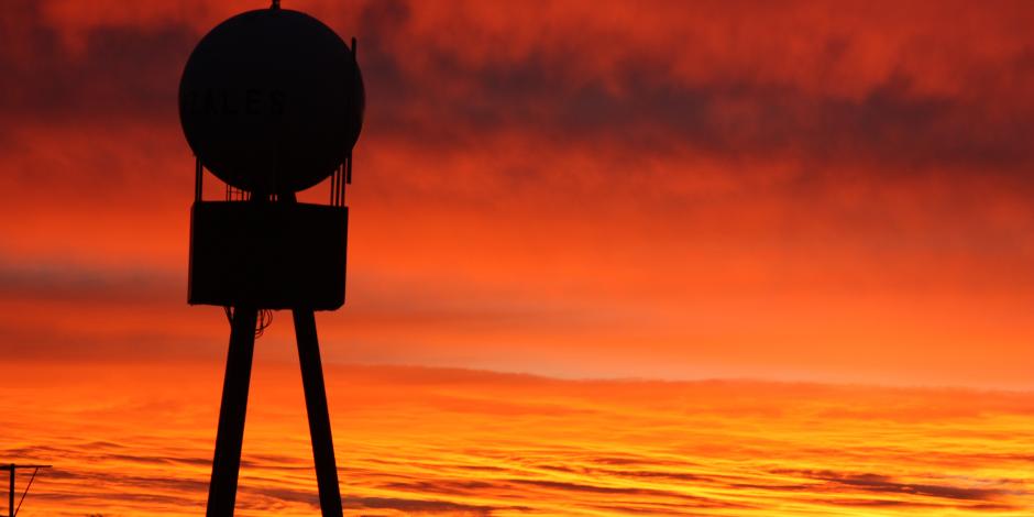 Silhouette of Gonzales Water Tower with sunset sky