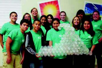 Youth with wave made out of recycled plastic bottles