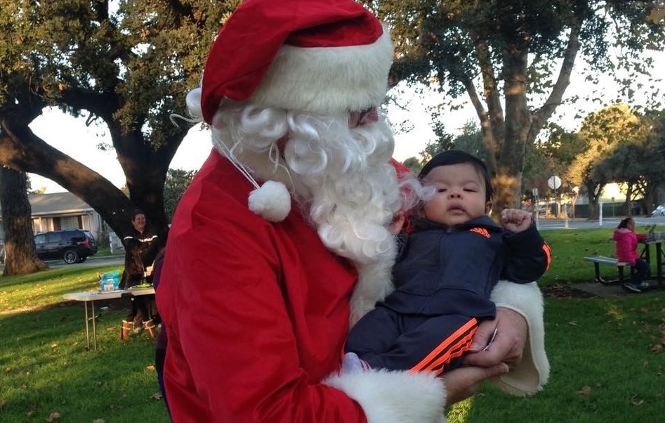 Santa in Central Park holding a child
