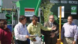 City Manager, Rene Mendez receiving award, outside with sun shining