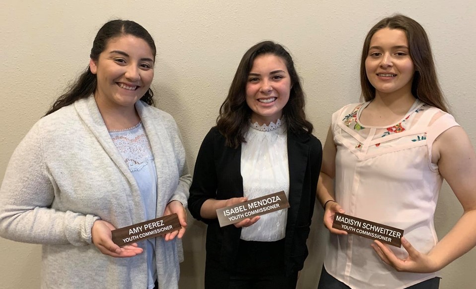 2020 Youth Commissioners standing with their name tags