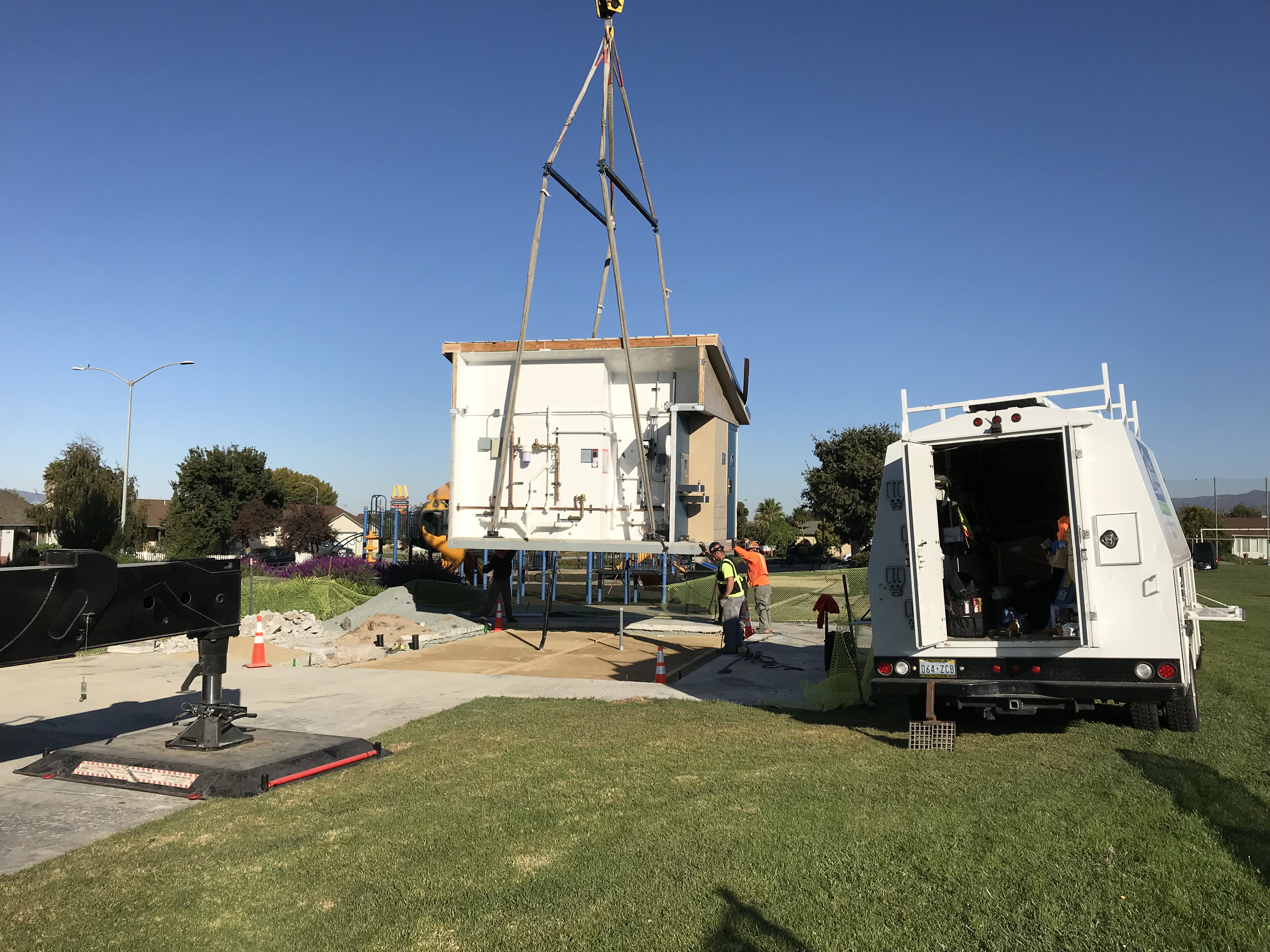 Part of the restroom being lowered into position