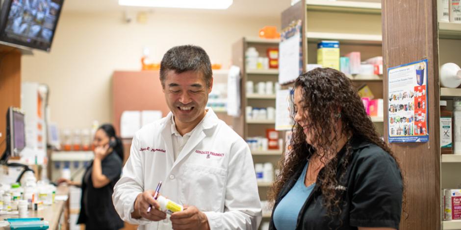 Pharmacy technicians Rosa Leon (left) and Imelda Lopez (right) with longtime owner Jimmy Eitoku (center) at Gonzales Pharmacy.