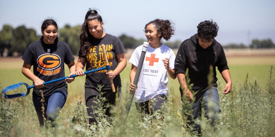 As part of the Wings of Knowledge program, Veronica Rodriguez, Leslie Hernandez, Maria Lopez, and Andres Hernandez (left to right) work on engineering projects on Gonzales farms. 