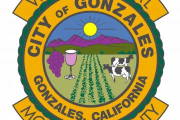City of Gonzales city seal, graphic of mountains, wine, cow, and field