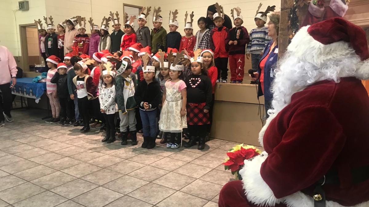 2019 Gonzales Holiday Celebration Photo: Santa watching children's choir