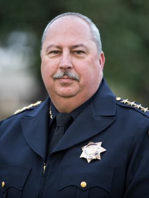 Chief Wise in uniform outside at a local park